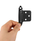 Person holding heavy duty self closing door hinge for RV cabinets and camper doors with no fuss semi concealed half overlay design