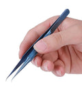 Ultra Fine 0.15mm Ti Alloy Tip For Phone Board Repair Soldering Bent Head Magnetic Tool held in hand, ideal for precise electronics repair.