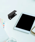 No Sweat Under Desk Laptop Bracket With Adjustable Angle Holder for Keyboard and Router Storage Black Plastic Build on a workspace.