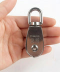 4 Pack M25 Stainless Steel Single Pulley Blocks For Lifting And Towing, 330 Lb Working Load Limit Snatch Blocks, Dual Line Setup, Ideal For Home DIY, Camping, And Hobby Hoisting. Stainless steel M25 single pulley block held in hand, 360° swivel top