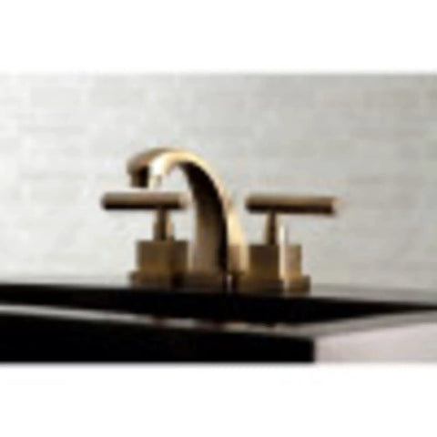 Brushed brass faucet on dark countertop, arch spout, dual handles, Claremont Mini Widespread Lavatory Faucet