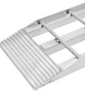 Close-up of Dual Runner Shed Ramps 3 Foot Long With Aluminum Serrated Rungs, showing serrated surface for traction.