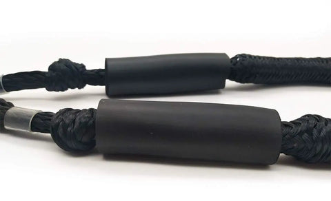 Close-up of black Shock Absorbing Bungee Dock Line for Boats, 4 ft, 4 pack, showing built-in snubber and durable material.