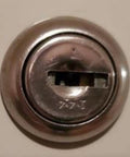 Close-up of a security lock for office furniture, compatible with Custom Cut File Cabinet And Cubicle Desk Replacement Key That Goes Like A Charm.