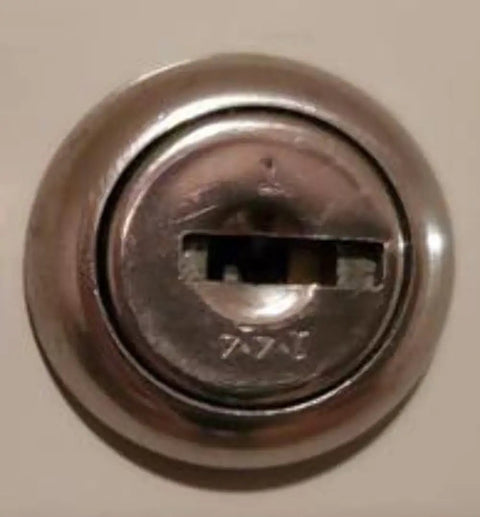 Close-up of a security lock for office furniture, compatible with Custom Cut File Cabinet And Cubicle Desk Replacement Key That Goes Like A Charm.