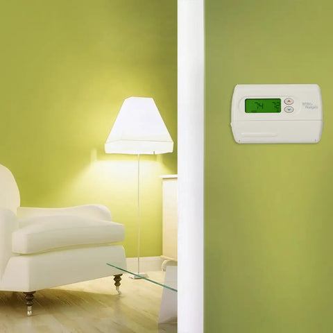 Living room with 7 Day Programmable Thermostat For Single Stage Heating And Cooling Systems With Backlit Display on green wall
