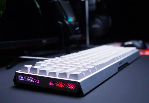 Rig Ready Aluminum Gaming Keyboard Featuring Smooth As Butter Mx2A Red Switches For Lightning Fast Response And Tight Control Paired With Vivid Rgb Lighting Sleek White Build And Reliable Wired Setup Control in low angle view