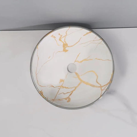 Round ceramic vessel sink with golden marble pattern, stylish bathroom wash basin, ideal for home and hotel use.