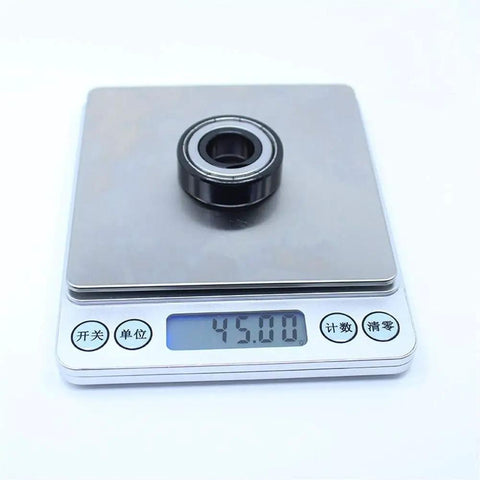 Badass High Temp 6202ZZ Deep Groove Ball Bearings 15X35X11MM rated for 500°C on a scale showing 45 grams weight