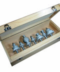 Kick Your Carpentry Game High With This 7 Pc Colonial Period Router Bit Set Featuring Boss Level Carbide Tips Heavy Duty Steel Bodies Perfect For Handheld Table Routers And Clean Cuts in a wooden storage box.