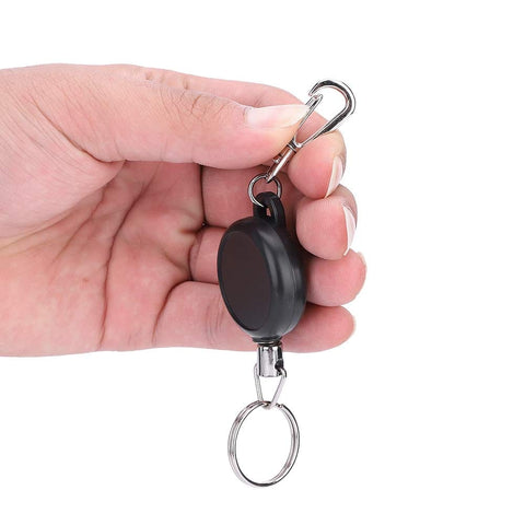 Hand holding an Extendable Keychain With Retractable Cord, 60cm Steel Wire Rope Key Reel, Heavy Duty Key Ring in ABS and Stainless Steel