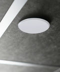 Slick Fit Galvanized Steel Recessed Fire Sprinkler Cover Plates 4 Pack Flush Ceiling Trim Ring on gray ceiling surface.