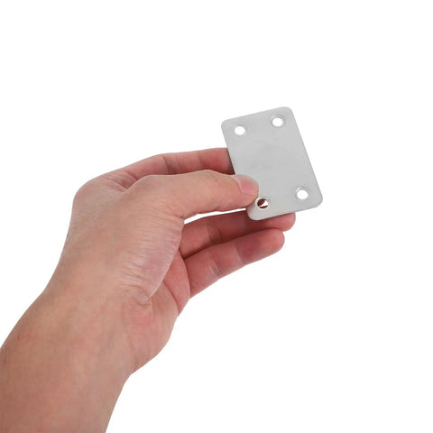 Close-up of a hand holding a stainless steel flat plate bracket, 1.1mm thick with 5mm holes, part of a 48 pack for home and office use.