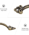 Close-up of 20-Piece Mini Antique Bronze Cabinet Pulls Set detailing rustic metal hardware with rounded corners for jewelry boxes.