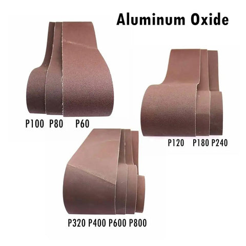Pro Grade Aluminum Oxide Sanding Belts 4 X 36 Five Pack Heavy Duty Abrasive Strips in various grits laid out for display.