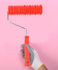 Hand holding a textured paint roller with cushioned grip, crafted from rubber, ideal for drywall applications.