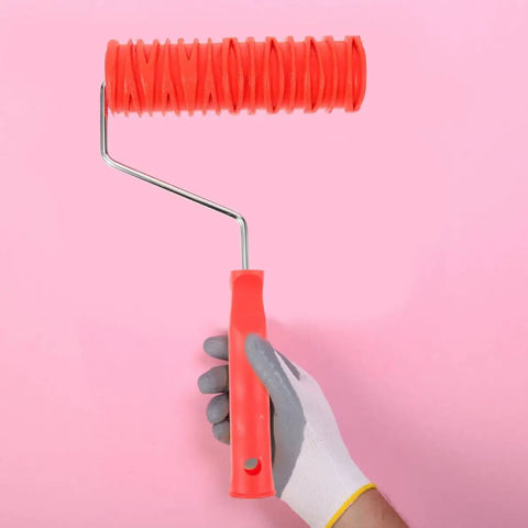 Hand holding a textured paint roller with cushioned grip, crafted from rubber, ideal for drywall applications.