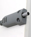 Silent Slam Free Cabinet Door Stoppers And Damper With Soft Close Push Type Catch attached on cabinet edge in gray color.