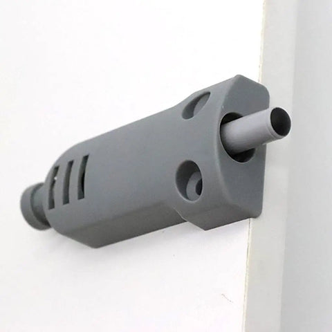 Silent Slam Free Cabinet Door Stoppers And Damper With Soft Close Push Type Catch attached on cabinet edge in gray color.