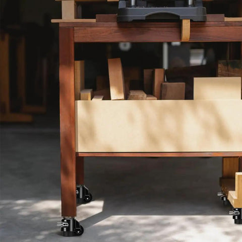 Top Notch Heavy Duty Leveling Stem Casters Set of Four Premium Aluminum Alloy retractable wheels on a wooden workbench.