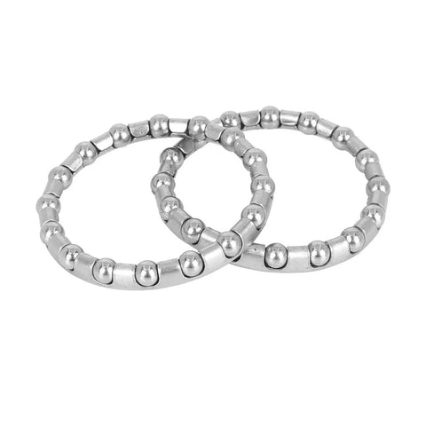Close-up of Four Pack 37 Point 2 Millimeter Bicycle Ball Bearing Cage Set With 16 Balls for crank and wheel retainers, steel build.
