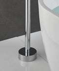 Close-up of floor-mounted chrome bath tub faucet base next to a clawfoot tub, part of free standing bathroom mixer tap setup.