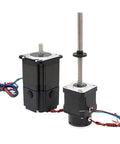 Treayes NEMA stepper motors; black units with silver plates, one with a long threaded lead screw and wiring