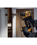 Heavy Hitter 20V Max Brushless Compact Drill Driver Boasting 1/2 Inch Ratcheting Chuck And 404 Uwo Torque, Pumping Out 1650rpm Revolutions Plus Bright Led Lights For No Sweat Job Site Hustle, Tool Only, handling a cabinet hinge.