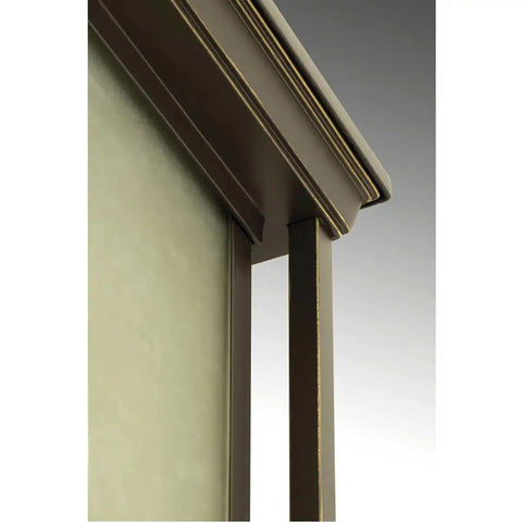 Close-up of frame detail in Antique Bronze on Endicott Collection 1-Light Outdoor Wall Lantern with Etched Umber Linen Glass
