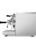 Alto Dual Boiler Espresso Machine With PID Control And Flow Adjustment For Top Shelf Precision Shots With Built In Timer And Pro Steam Paddle In Sleek Stainless Finish, side view showing portafilter and controls.