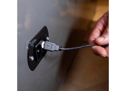 Person plugging a USB into Interior Safe Power Outlet Kit With USB And Ethernet For Dehumidifiers And Lights Powering Your Inside Safe Accessories Fits 2007 And Later Safes Easy Install For Better Organization And Security.