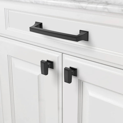 Close-up of a cabinet with an installed 5 inch matte black kitchen cabinet handle from the 10 pack collection, enhancing modern decor.