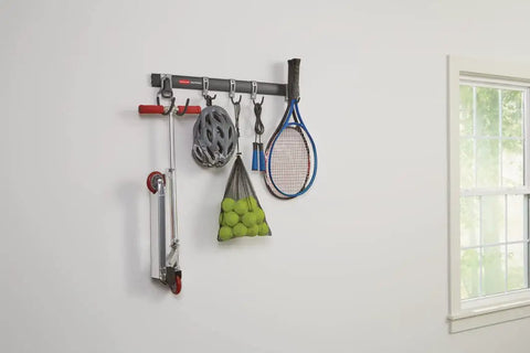 FastTrack Garage Hook Kit And Tool Organizer With All In One Rail for wall shed storage showing sports gear and helmet hanging.