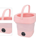 No Sweat Foldable Mini Washing Machine, Portable Compact Washer For Quick Cycles, Pink with handle for easy carrying.