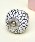 100 Piece White Floral Ceramic Drawer Knobs For Kitchen Cabinets And Dresser Pulls with silver accent and floral design.