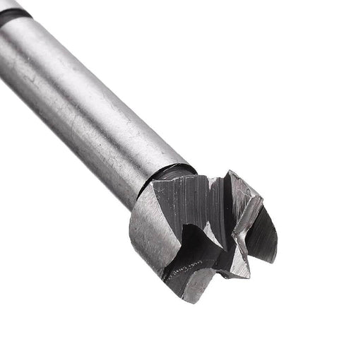 Woodworking drill bit; close-up of a silver steel bit with a multi-flute cutting head.