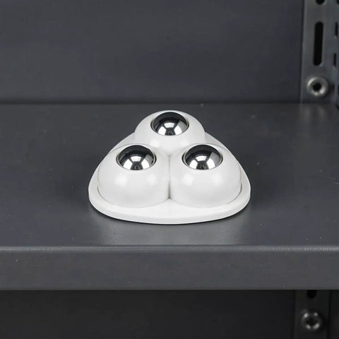 12pcs Furniture Caster Wheels Self Adhesive 360 Degree Swivel in white base with 3 shiny metal balls on a dark shelf.