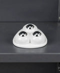 12pcs Ball Self Adhesive Furniture Caster Wheels 360 Degree Swivel set on a gray shelf, highlighting their smooth, shiny design.