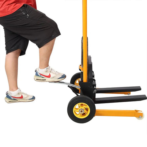 Heavy Duty Hydraulic Manual Lift Stacker With 440 Lb Capacity And Adjustable Forks angled view with foot on pump pedal.