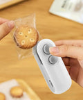Person using a 2 In 1 Mini Bag Sealer With Cutter And Magnetic Resealer, Rechargeable Heat Seal on a cookie package.