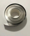 Top Tier Industrial Pure Titanium Foil Sheet Badass Heavy Duty Metal Belt shown in roll form for workshops, dimensions not visible.