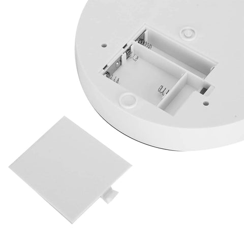 Detail of the bottom of Smooth Rotating Display Stand With Electric Turntable For Jewelry Watches Phones And Bags, featuring battery compartment.