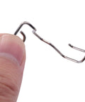 Close-up of a silver steel sewing machine finger guard for hand protection, part of the Six Pack Sewing Machine Finger Guards.