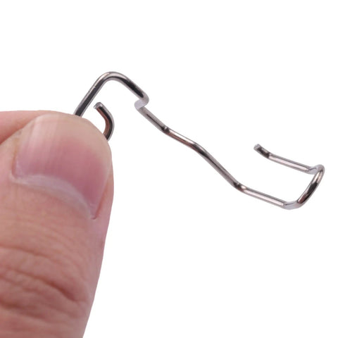 Close-up of a silver steel sewing machine finger guard for hand protection, part of the Six Pack Sewing Machine Finger Guards.