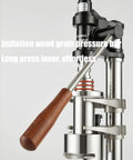 Manual Leverage Espresso Coffee Maker With 16 Bar Hand Pressure Pump showing stainless steel build and wooden handle.