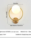 Modern Luxury Sphel Glass lampshade Wall Sconce 9.0 Inch Width den Iron Body Wall Lamp with 3 Color Mode Indoor Lighting Fixture for Bedroom Living Room Study Hallway, showing gold circular design and frosted glass.
