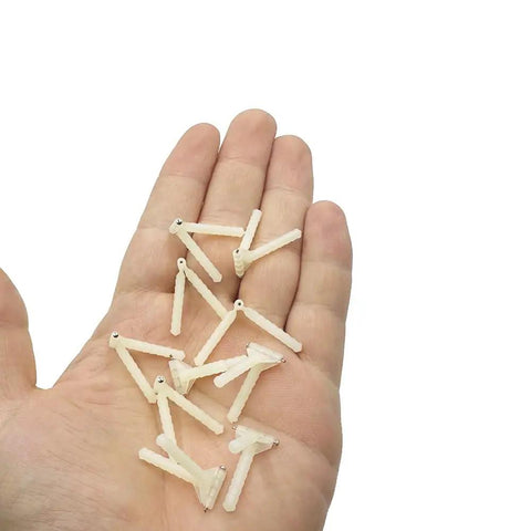 Hand holding Durable Plastic Needle Hinge Pins For RC Planes And Helis 2.5x43mm 10 Pack Easy Wing Fix For Foam And Balsa Aircraft DIY Model Plane