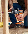 Pro Grade Brushless 18 Volt Cordless Drill Driver Kit With Compact Battery And Quick Charger being used to drill into wood stud.
