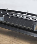 Close-up of MB48B 48 Inch Pan Style Mini Brake in use, showing bending mechanism for 22 gauge galvanized steel on a bench.