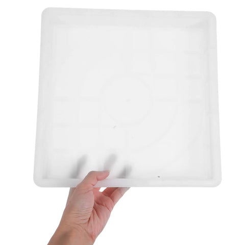 DIY Concrete Molds For Walkways And Patios Easy To Use Square Flagstone Paver Casting Mold held by a hand showing size